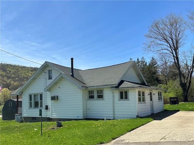 7 Hedgehog Ln, Bradford-Town, PA 16701 - back of property with a yard and a shingled roof