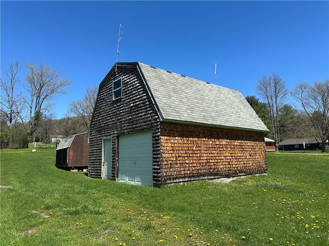 7 Hedgehog Ln, Bradford-Town, PA 16701 - view of side of home with a detached garage, an outbuilding, and a yard