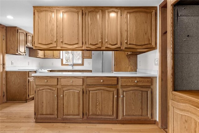 7317 County Highway 33, Kortright, NY 13739 - kitchen featuring light wood finished floors, brown cabinets, and light countertops