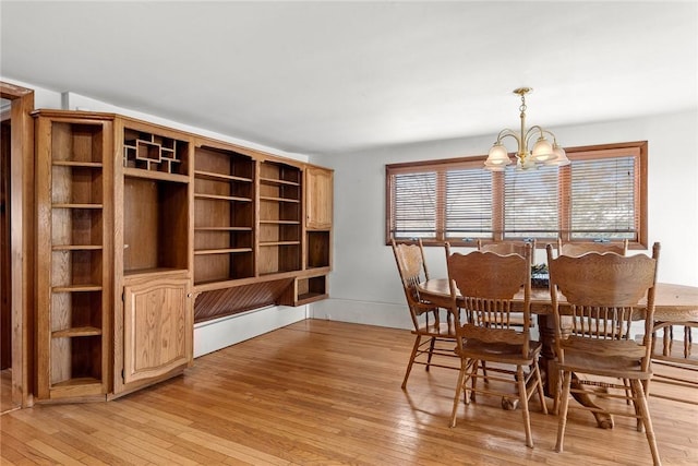 7317 County Highway 33, Kortright, NY 13739 - dining room featuring a notable chandelier and light wood-style floors