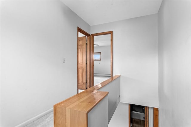 7317 County Highway 33, Kortright, NY 13739 - corridor featuring light carpet, baseboard heating, and baseboards