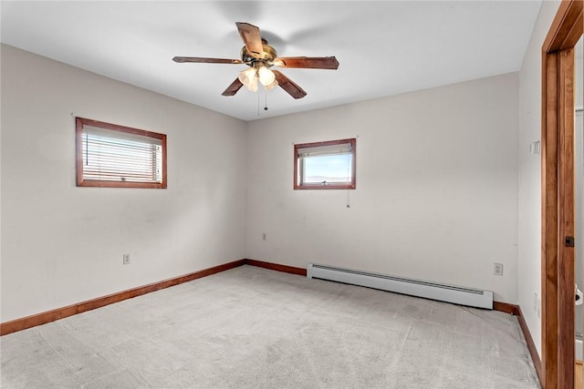 7317 County Highway 33, Kortright, NY 13739 - spare room featuring a baseboard heating unit, baseboards, light colored carpet, and ceiling fan