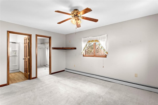 7317 County Highway 33, Kortright, NY 13739 - unfurnished bedroom with light carpet, baseboard heating, a walk in closet, and baseboards