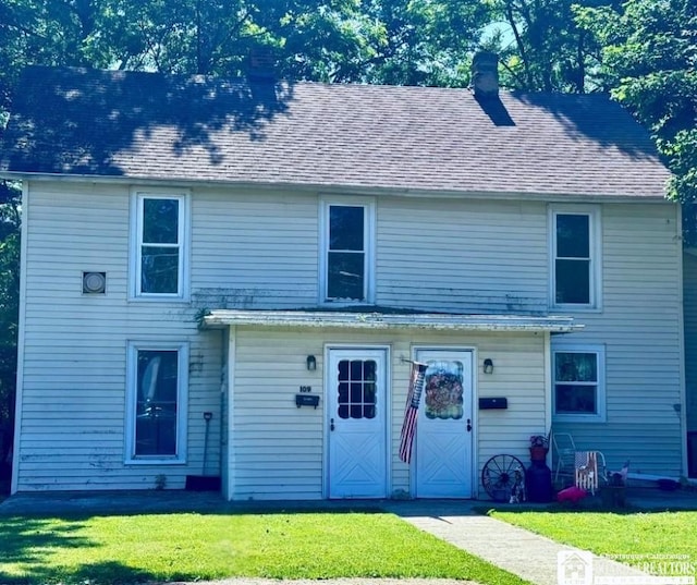 109 Prospect St, Pomfret, NY 14063 - view of front of house featuring a front yard, a chimney, and roof with shingles