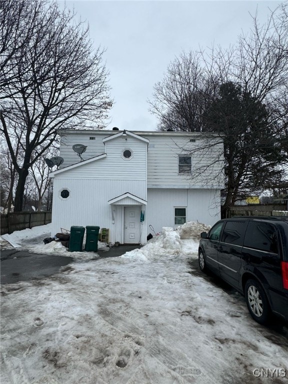 163 E 9th St, Oswego-City, NY 13126 - view of snow covered exterior with fence