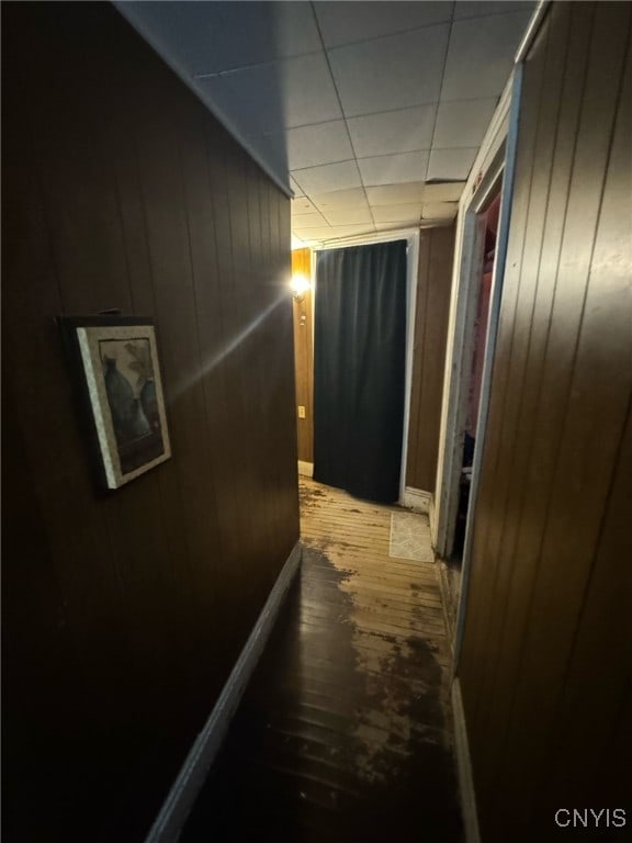 163 E 9th St, Oswego-City, NY 13126 - hall with wood-type flooring and wooden walls