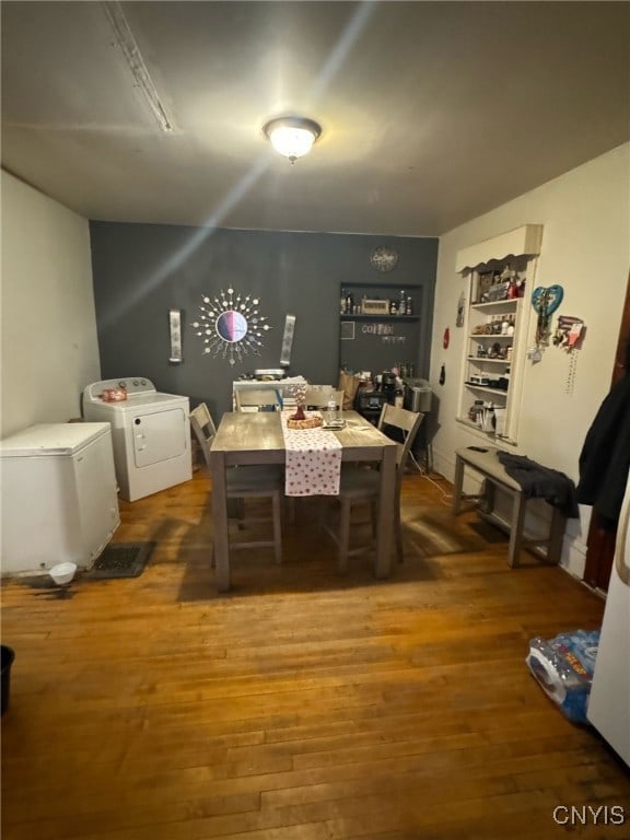 163 E 9th St, Oswego-City, NY 13126 - dining area featuring wood finished floors and washing machine and clothes dryer