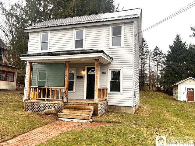 298 S Main St, Jamestown, NY 14701 - view of front of house with an outbuilding, a storage shed, covered porch, and a front lawn