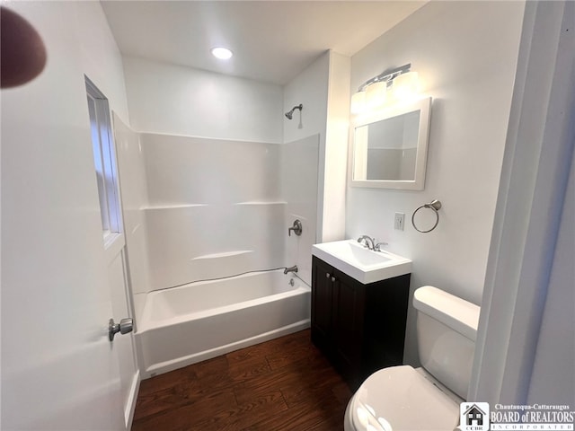298 S Main St, Jamestown, NY 14701 - full bath featuring toilet, wood finished floors, recessed lighting, bathtub / shower combination, and vanity