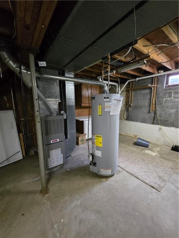 basement featuring heating unit and gas water heater