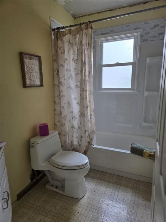 bathroom with vanity, toilet, tile patterned floors, and shower / tub combo