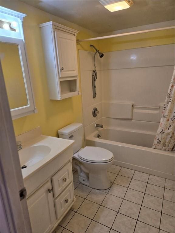 bathroom with shower / bath combination with curtain, tile patterned flooring, vanity, and toilet