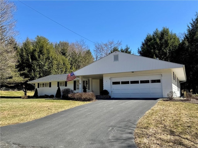 4 Ravine Park N, Oneonta-City, NY 13820 - ranch-style house with a garage, driveway, and a front lawn