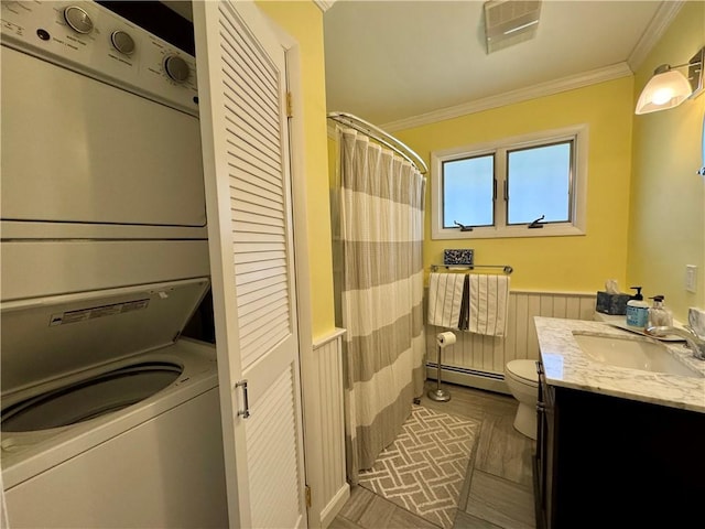 4 Ravine Park N, Oneonta-City, NY 13820 - full bath with estacked washer and dryer, a wainscoted wall, baseboard heating, crown molding, and vanity