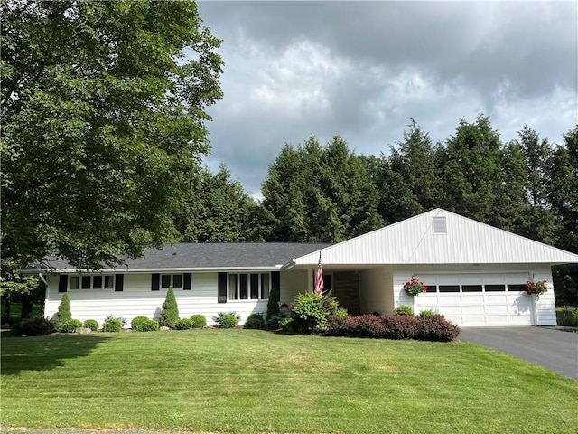 4 Ravine Park N, Oneonta-City, NY 13820 - single story home with an attached garage, asphalt driveway, and a front lawn