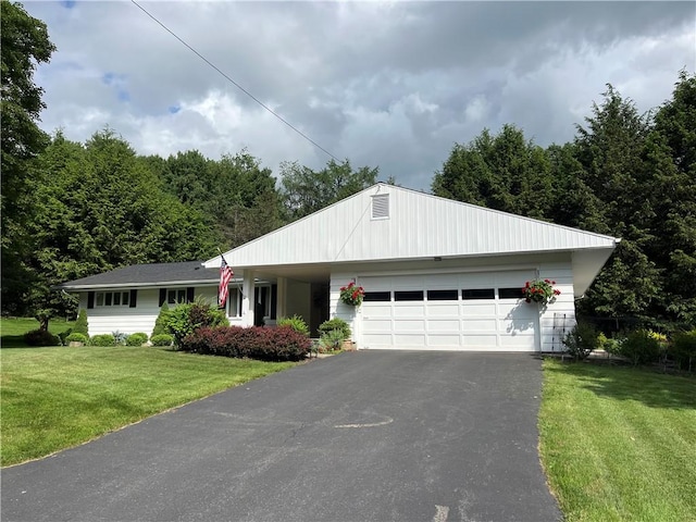4 Ravine Park N, Oneonta-City, NY 13820 - single story home featuring an attached garage, a front lawn, driveway, and a forest view
