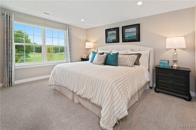 bedroom with visible vents, recessed lighting, carpet, and baseboards