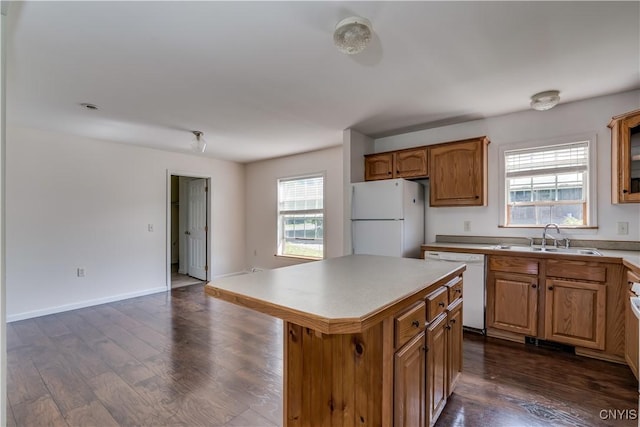 36194 State Route 180, Orleans, NY 13656 - kitchen with white appliances, brown cabinetry, a kitchen island, dark wood finished floors, and a sink