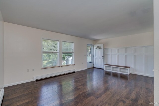 36194 State Route 180, Orleans, NY 13656 - interior space with wood finished floors, baseboards, and baseboard heating