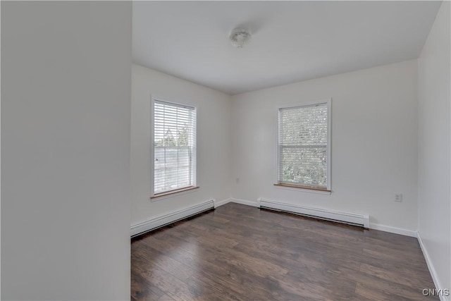 36194 State Route 180, Orleans, NY 13656 - unfurnished room featuring a baseboard heating unit, dark wood-type flooring, and baseboards