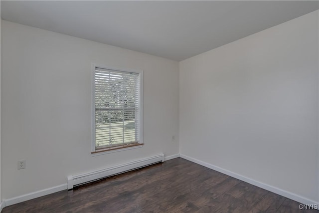 36194 State Route 180, Orleans, NY 13656 - empty room featuring a baseboard heating unit, baseboards, and dark wood-type flooring