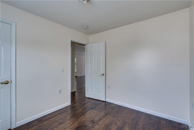 36194 State Route 180, Orleans, NY 13656 - unfurnished bedroom with dark wood-type flooring and baseboards