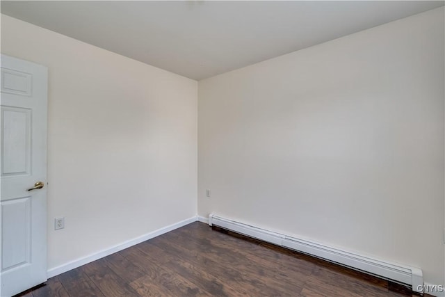 36194 State Route 180, Orleans, NY 13656 - unfurnished room featuring a baseboard heating unit, baseboards, and dark wood finished floors