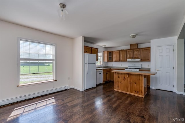 36194 State Route 180, Orleans, NY 13656 - kitchen featuring a center island, under cabinet range hood, dark wood-style floors, white appliances, and a baseboard radiator