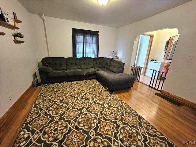 220 Odell Ave, Union, NY 13760 - living area with visible vents, arched walkways, baseboards, and wood finished floors