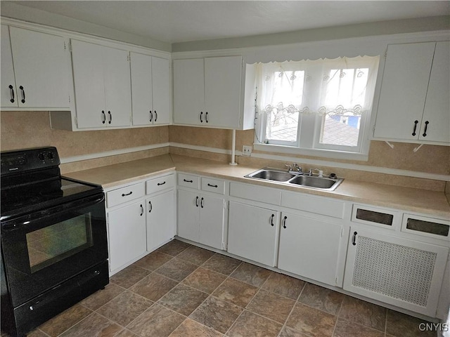 220 Odell Ave, Union, NY 13760 - kitchen with white cabinetry, light countertops, black / electric stove, and a sink