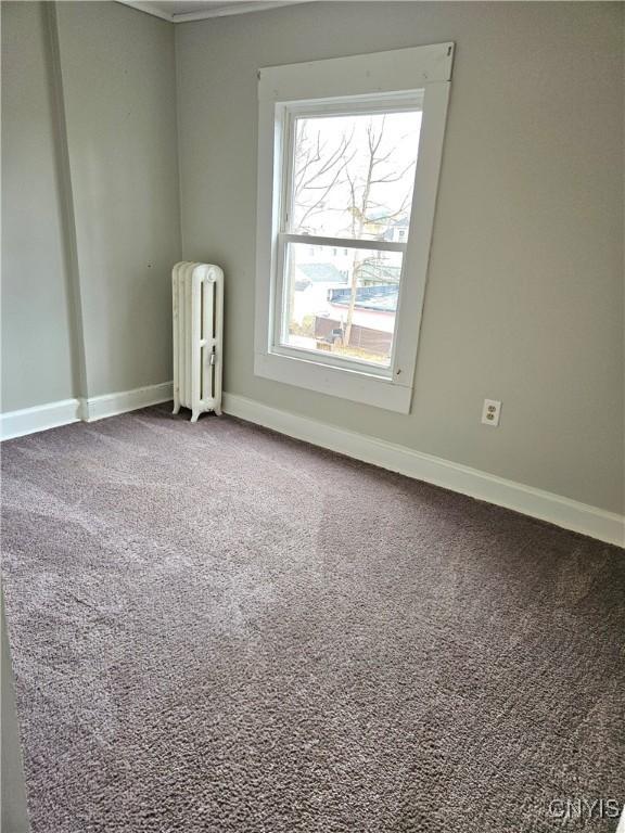 220 Odell Ave, Union, NY 13760 - carpeted empty room featuring radiator and baseboards