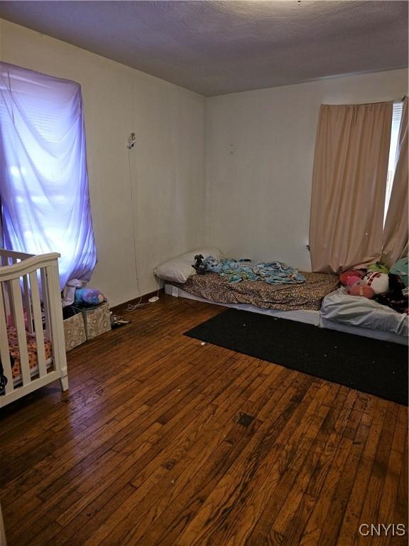 220 Odell Ave, Union, NY 13760 - unfurnished bedroom featuring hardwood / wood-style flooring