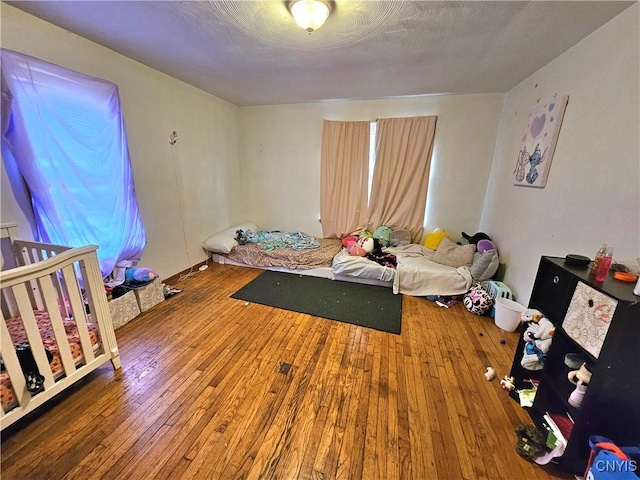 220 Odell Ave, Union, NY 13760 - bedroom featuring a textured ceiling and hardwood / wood-style floors