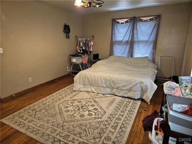 220 Odell Ave, Union, NY 13760 - bedroom featuring a chandelier, baseboards, and wood finished floors