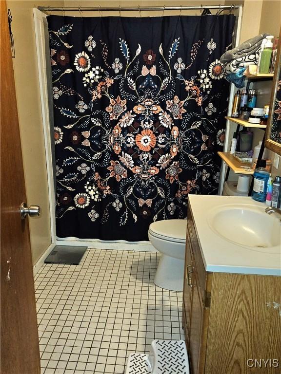 220 Odell Ave, Union, NY 13760 - bathroom featuring tile patterned flooring, a shower with shower curtain, toilet, and vanity