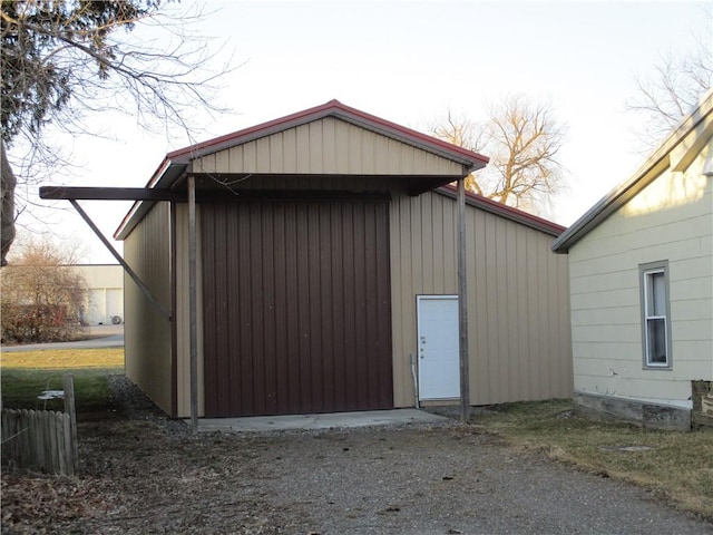 view of outbuilding with driveway and an outdoor structure
