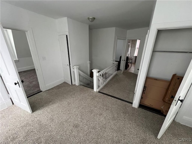 13 Birdsall St, Norwich-City, NY 13815 - corridor with an upstairs landing, baseboards, and carpet floors