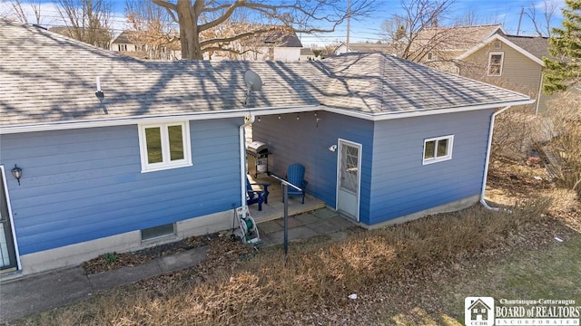 92 E Pine St, Dunkirk-City, NY 14048 - view of property exterior with a patio area and a shingled roof