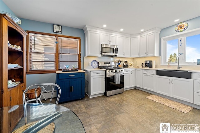 92 E Pine St, Dunkirk-City, NY 14048 - kitchen with light countertops, white cabinets, appliances with stainless steel finishes, and a sink