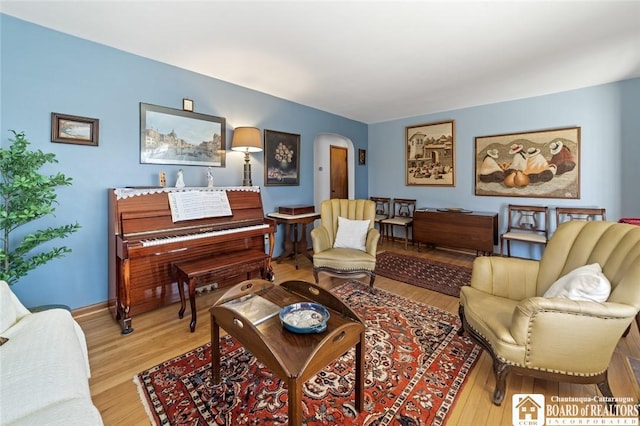 92 E Pine St, Dunkirk-City, NY 14048 - living area featuring arched walkways, light wood-style flooring, and baseboards