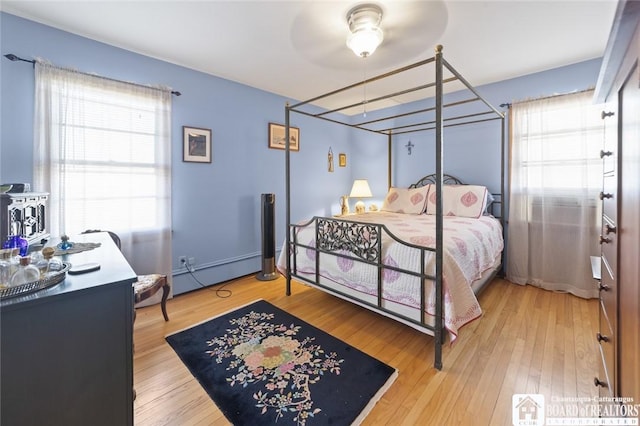 92 E Pine St, Dunkirk-City, NY 14048 - bedroom featuring a baseboard radiator and light wood-style flooring