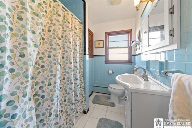 92 E Pine St, Dunkirk-City, NY 14048 - full bath featuring tile patterned flooring, toilet, vanity, tile walls, and a baseboard radiator