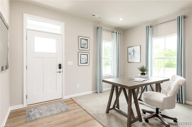 entryway with visible vents, recessed lighting, light wood-type flooring, and baseboards