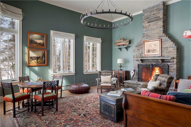 196 Wellington Ln, Springfield, NY 13326 - living room with wood finished floors, ornamental molding, and a fireplace