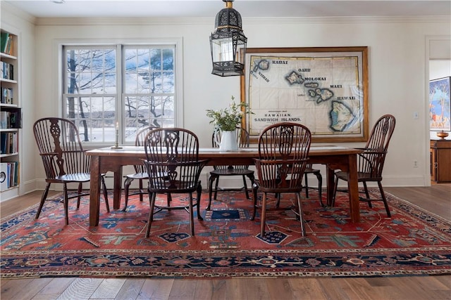 196 Wellington Ln, Springfield, NY 13326 - dining space with wood finished floors and ornamental molding