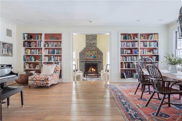 196 Wellington Ln, Springfield, NY 13326 - office with built in features, a fireplace, ornamental molding, and wood finished floors