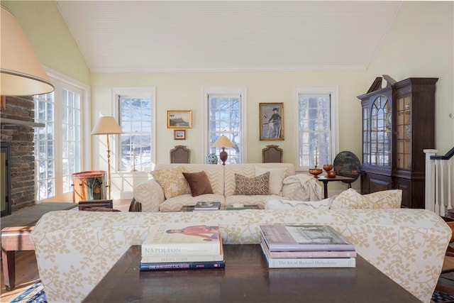 196 Wellington Ln, Springfield, NY 13326 - living area with lofted ceiling, a fireplace, and ornamental molding