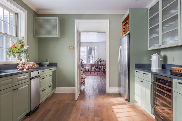 196 Wellington Ln, Springfield, NY 13326 - indoor dry bar featuring wine cooler, freestanding refrigerator, light wood-type flooring, and ornamental molding
