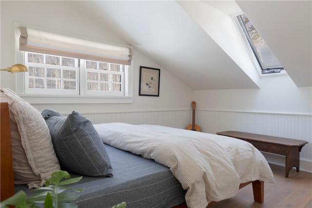 196 Wellington Ln, Springfield, NY 13326 - bedroom with wood finished floors, lofted ceiling, and wainscoting