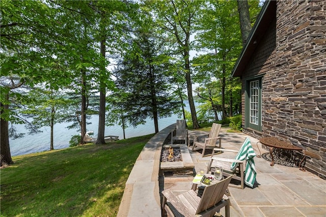 196 Wellington Ln, Springfield, NY 13326 - view of patio featuring a water view and a fire pit